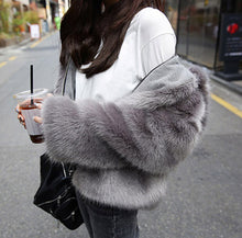 Stylish Loose Hooded Faux Fox Fur Jackets Woman Loose sleeve Keep Warm Faux Fur Thick Coat Outerwear